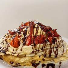 Waffles with fruit ice cream and chocolate sauce